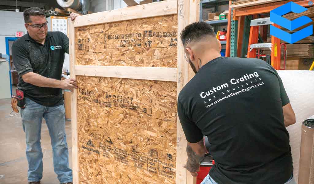 shipping company workers creating a crate